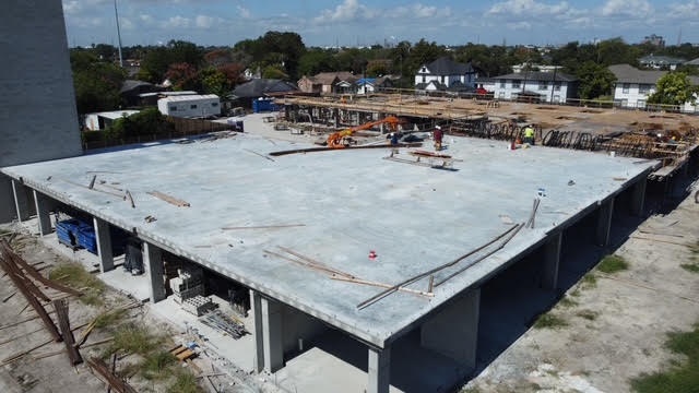 Completed elevated concrete deck over a commercial structure