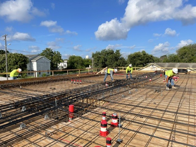 Bahamian Builders crew preparing a structural deck on an active job site