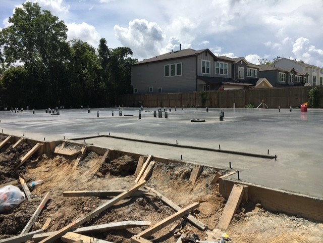 Finished residential foundation slab with plumbing stub-ups in place