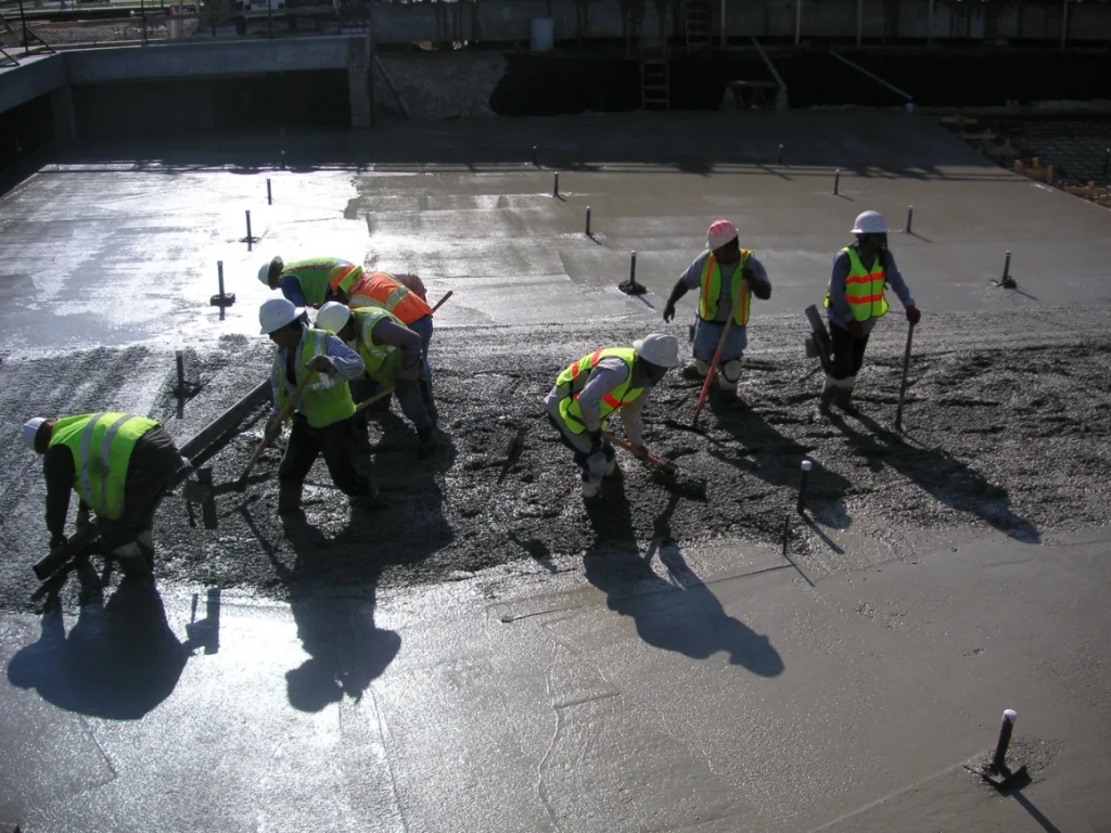 Bahamian Builders crew pouring concrete on a commercial job site
